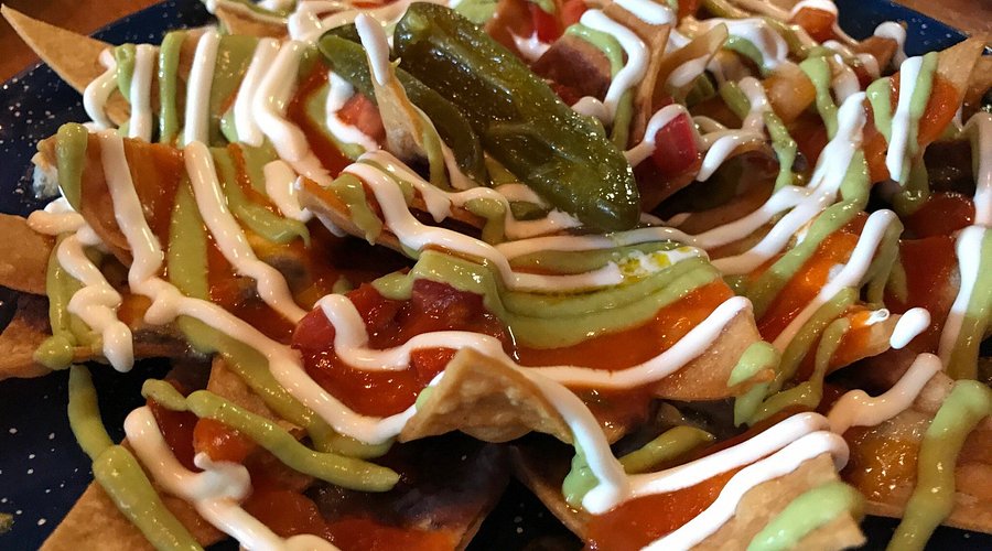La Contenta LES signature dishes La Contenta NachosEnchiladas SuizasGuacamole TradicionalTacos de Carne Asada